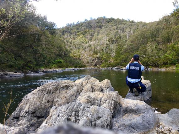 Fisheries officer conducting surveillance on a river near Coffs Harbour