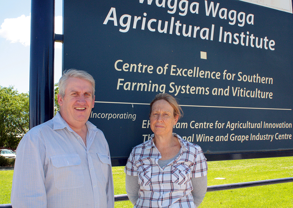 Craig and Janelle are standing in front of the Wagga Wagga research station entry sign
