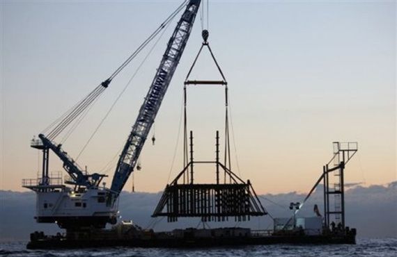 An artificial reef being lowered into the water.