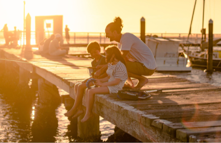 Family fishing from a jetty