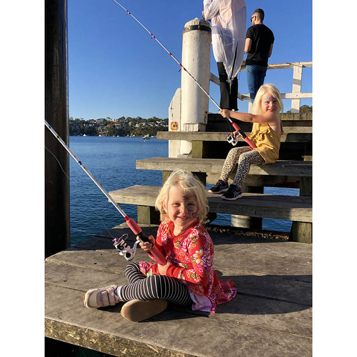 Girls fishing on a pier