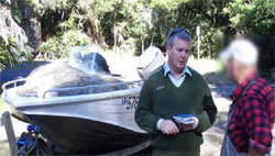 A Fisheries Officer interviews a fisherman
