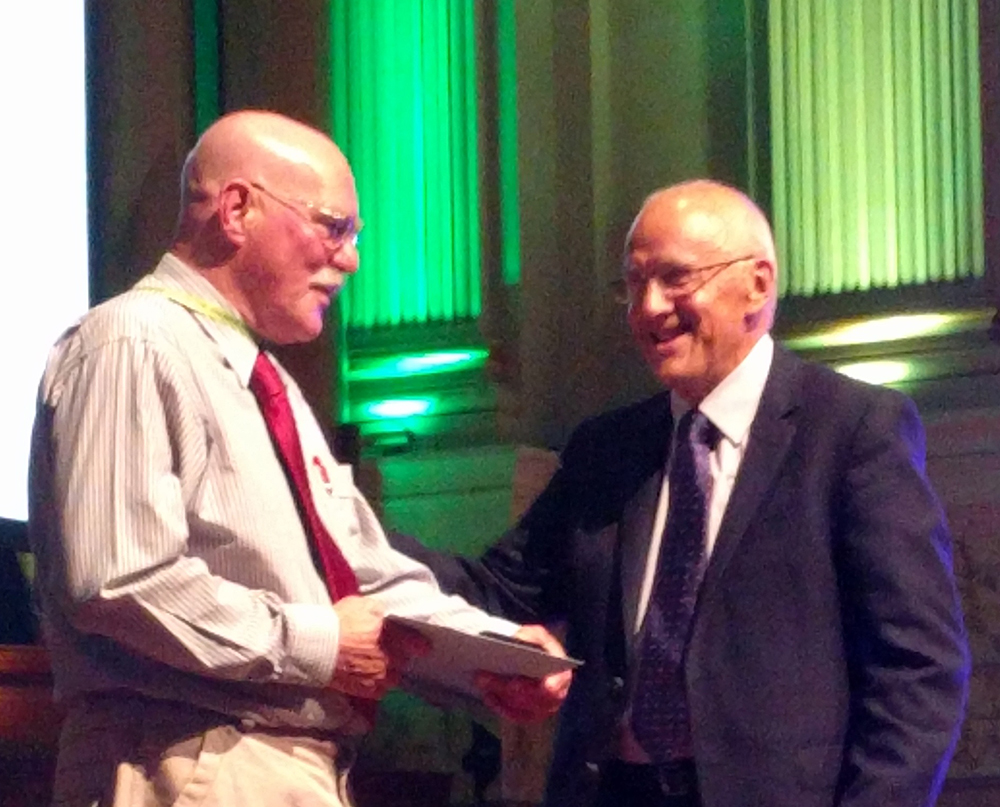 Dr Moore proudly receives his award 