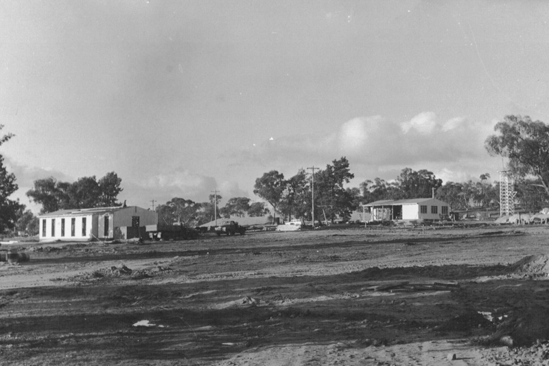 Early construction of hatchery building and cottage.