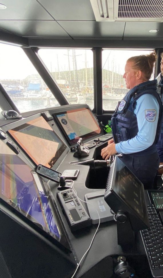 Fisheries officer piloting the offshore patrol vessel Solitary Ranger