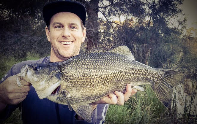 Recreational fisher, Blake Fallon showing off an Australian Bass he caught recently