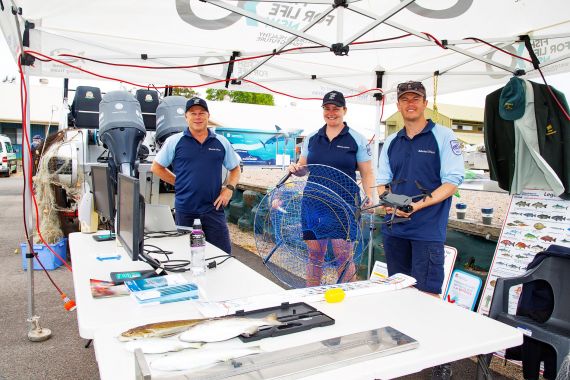 Fisheries officers manning an educational display at a community event on the NSW North Coast