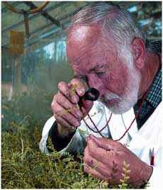scientist with hand lens
