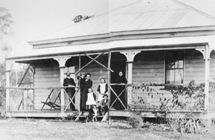 GM McKeown and family standing on the verandah of the Manager's Cottage of Wollongbar Experimental Farm c 1896