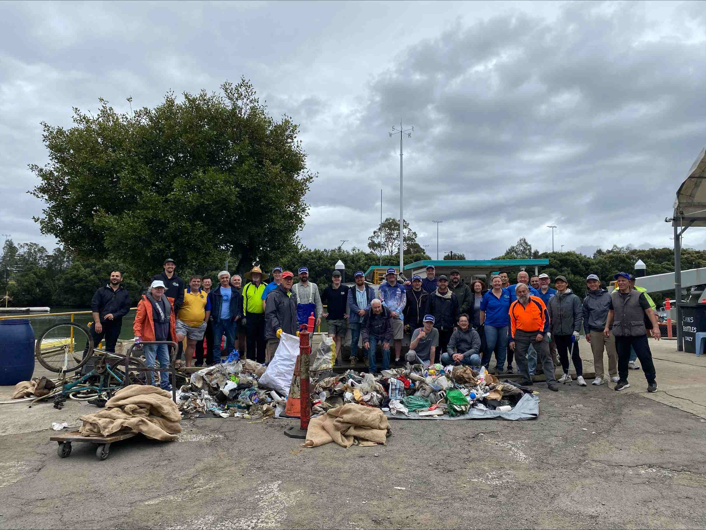people with litter collected from clean up