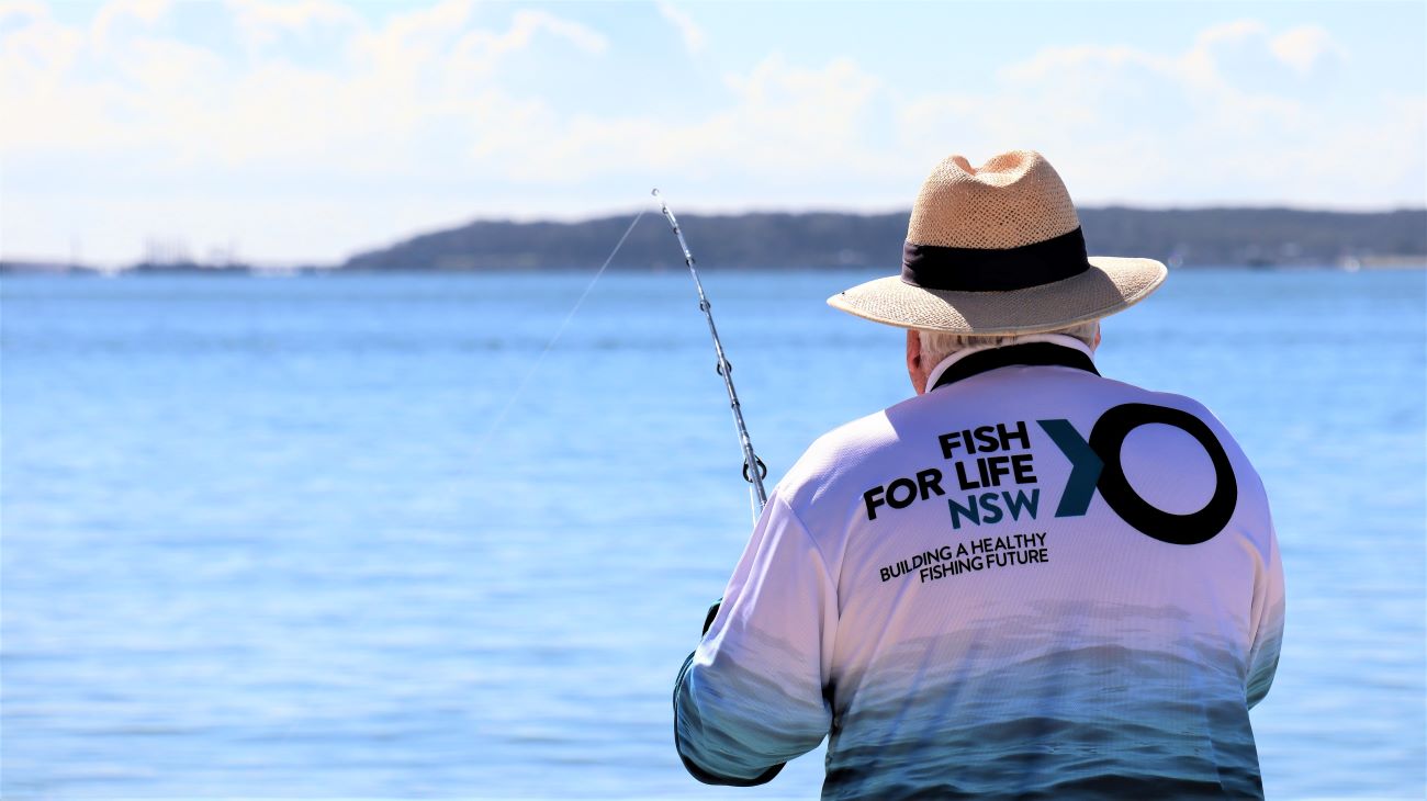 https://www.dpi.nsw.gov.au/__data/assets/image/0012/1466679/Fish-for-Life-logo-on-fisherman-NS.jpg