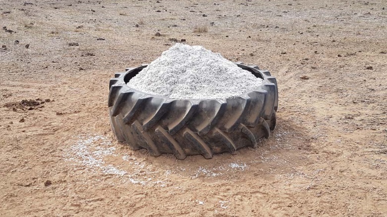 A large tractor tyre with feed in the middle makes a good trough