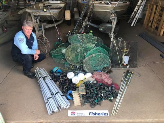 Fisheries officer with illegal fishing gear seized from North Western NSW rivers and impoundments